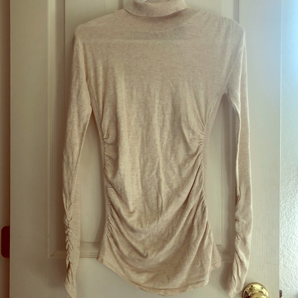 Cream turtleneck by Moda International